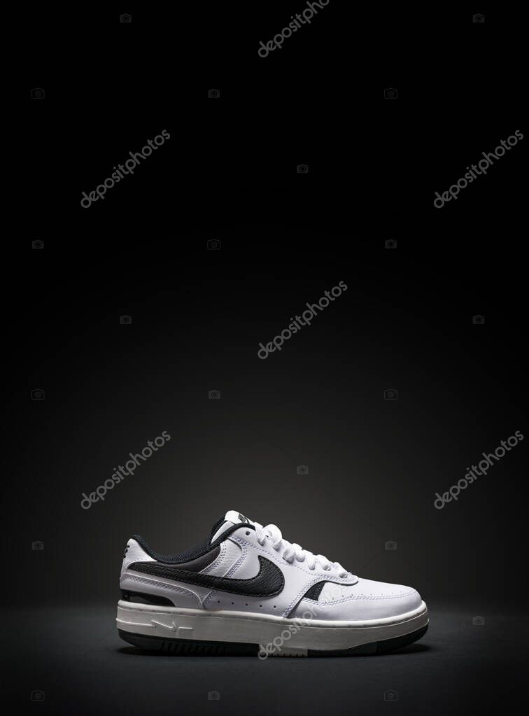 Antalya, Turkey - April 15, 2025: White Nike Gamma Force sneakers on black background