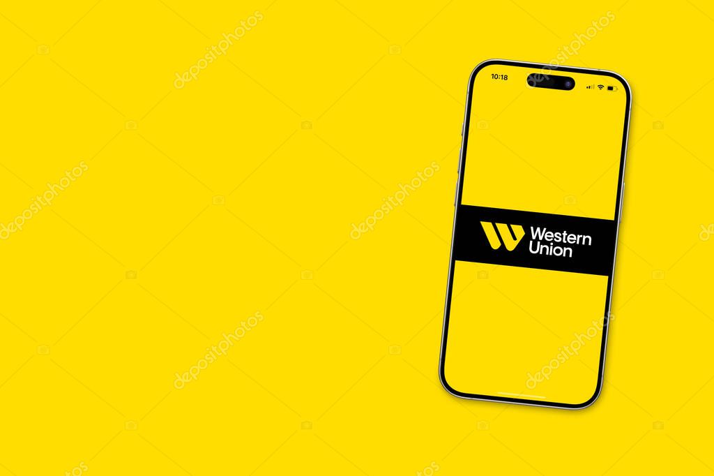 Antalya, Turkey - September 29, 2025: Western Union logo on iphone screen on yellow background