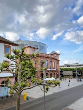 Mainz, Germany - May 20, 2020: Mainz State Theatre and Gutenbergplatz against blue sky with clouds