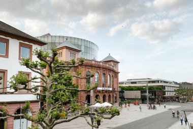 Mainz, Germany - May 20, 2020: Mainz State Theatre and Gutenbergplatz against blue sky with clouds