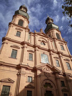 Low angle view of St. Peter church in Mainz, Germany against blue sky with clouds