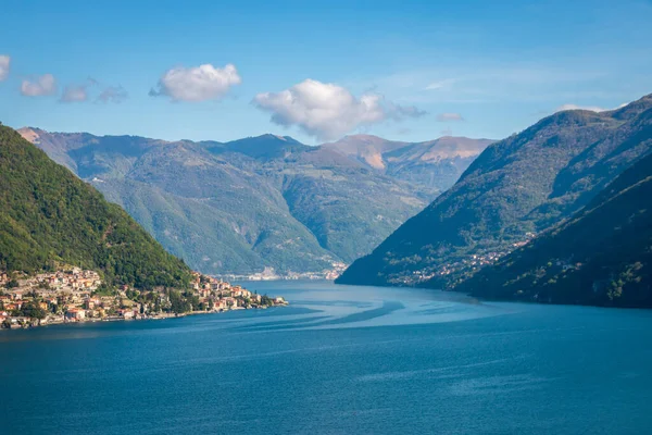 stock image Scenic view of Lake Como, Italy and its southwestern branch looking north with Laglio and Torrigia against blue sky