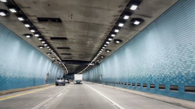 Kaneohe, USA - April 2, 2024: Inside to Tetsuo Harano Tunnel on Interstate H-3 highway called John A. Burns Freeway driving west on the Hawaiian island of Oahu, USA clipart