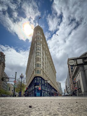 San Francisco, California, USA - April 12, 2024: Low angle view of Phelan Building at Market Street against blue sky with clouds clipart