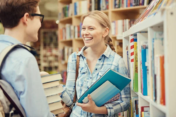 Jolly Young Students Standing Bookshelf Library Holding Textbooks Workbooks While Stock Photo