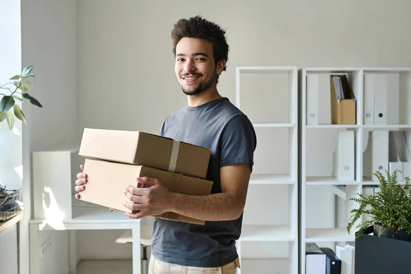Portrait Young Man Smiling Camera While Carrying Packed Boxes Office — Stock Photo, Image