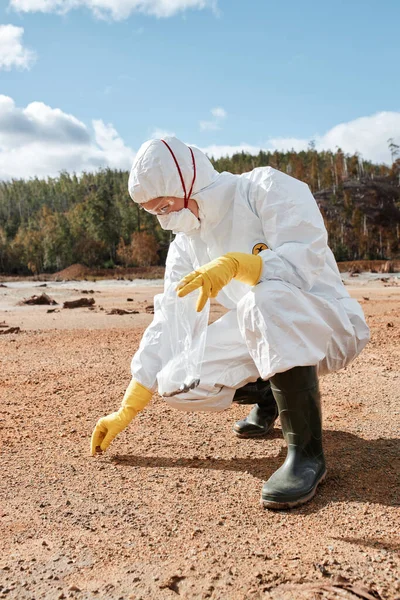 Ecologist Hazmat Suit Crouching Land Collecting Samples Polluted Soil Territory Stock Photo