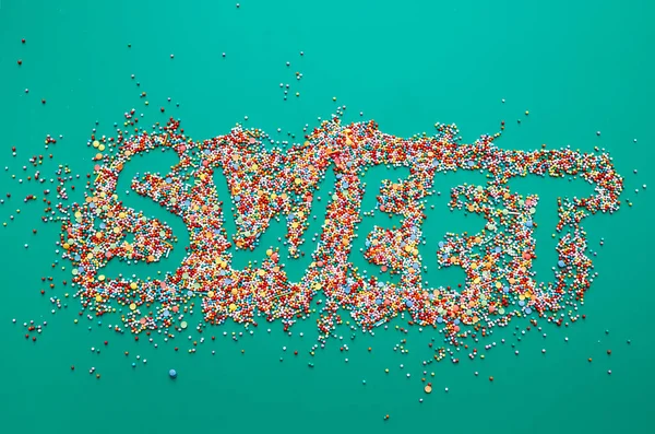 Sweet Inscription Written Colorful Sprinkles Green Background — Stock Photo, Image