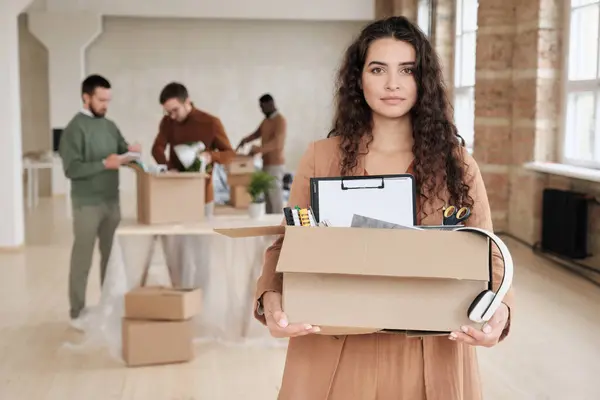 Portrait Content Curly Haired Woman Holding Moving Box Personal Stuff — Stock Photo, Image