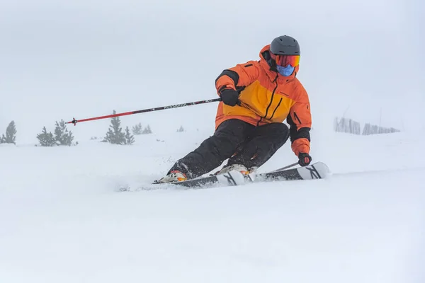 stock image Man skiing in the Pyrenees at the Grandvalira ski resort in Andorra.