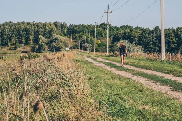 Row Electric Poles Wires Woman Walks Country Road — Stock Photo, Image