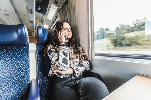 single woman traveling by train