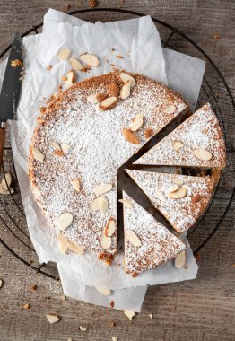 Almond cake overhead shot with three slices clipart