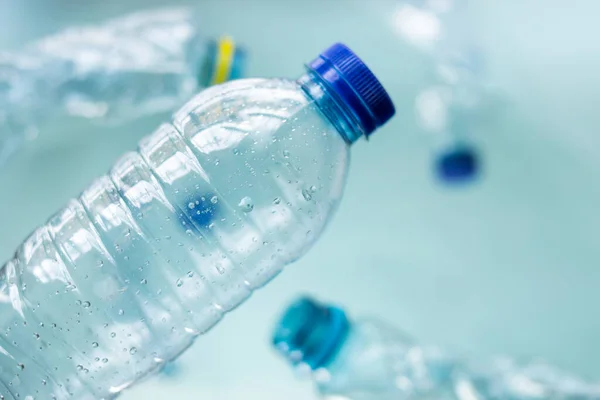 Algunas Botellas Plástico Sobre Fondo Azul —  Fotos de Stock