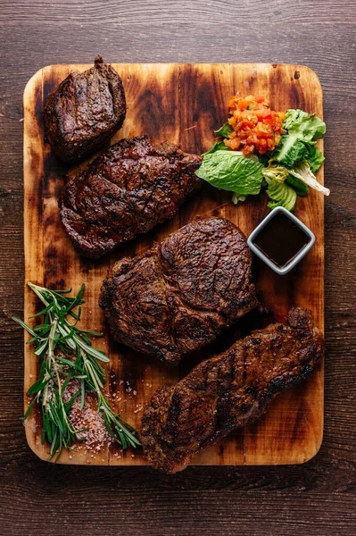 Four Types Different Steaks Wooden Board — Stock Photo, Image