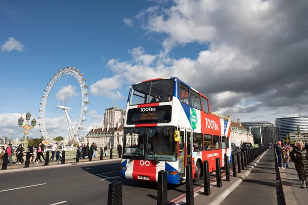 Stock image Tourism sightseeing bus over Westminster Bridge