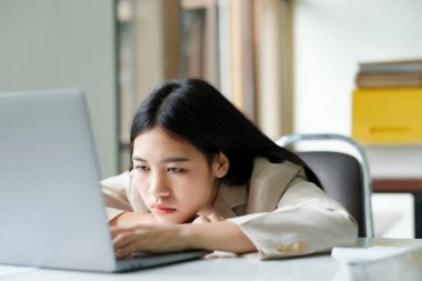 Stressed overwork businesswoman in the office.
