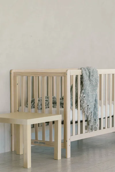 Modern home decor in neutral colored home with baby crib