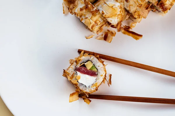 stock image japanese sushi rolls with tuna chips, salmon and avocado