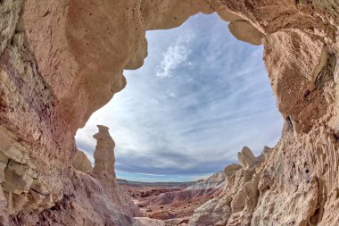 View from within a shallow cave in the Jasper Forest at Petrified Forest National Park Arizona. clipart