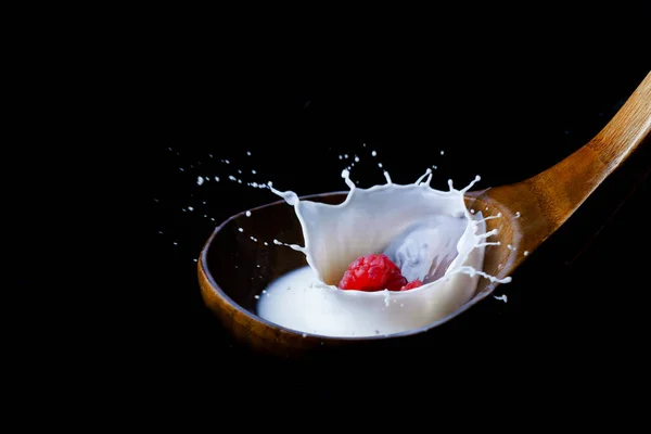 Fresh Raspberry Splashing Milk Wooden Spoon Splash Effect Black Background — Stock Photo, Image