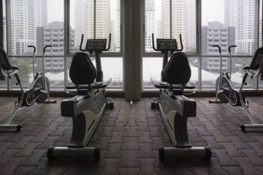 Exercise Bike Facing Urban Jungle At Condominium Gym