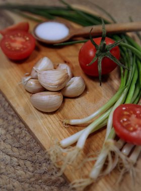 cherry tomatoes  with salt, garlic and green onions
