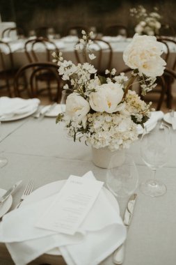 Wedding white roses in vase on table decoration