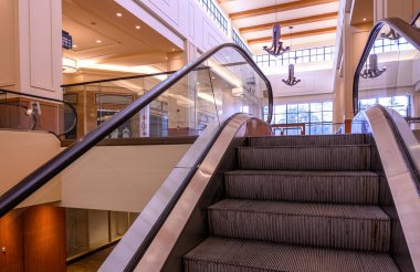 Escalators in a closed down shopping mall.
