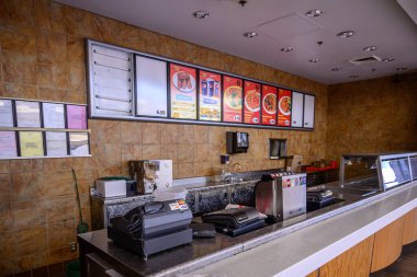 Closed out of business restaurant in a shut down a shopping mall.