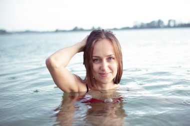 Girl in the lake in the rain