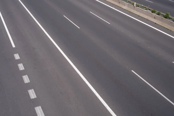Road markings, marking different lanes, asphalt floor of a highway