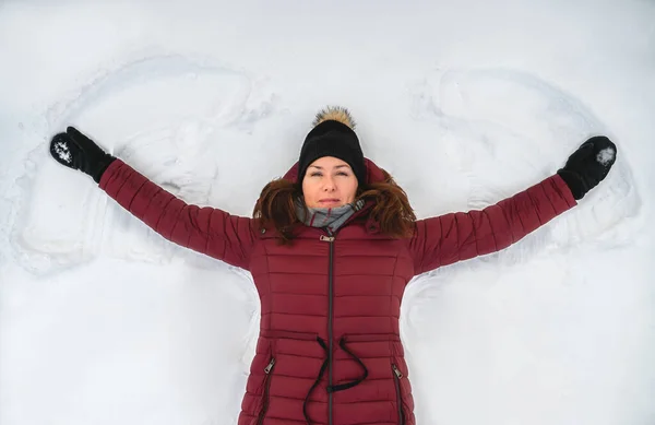 Top View Woman Red Winter Coat Making Snow Angel Winter — Stok fotoğraf