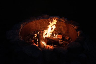 Campfire At Night in the Summer Time While Camping