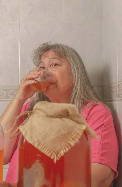 Elderly Woman Drinking Glass Fermented Kombucha Tea Alternative Health Concept — Stock Photo, Image