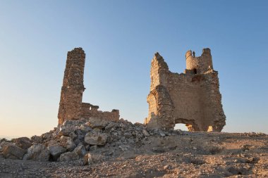 Caudilla castle in ruins in a sunny field at sunset in spring.Toledo, Castilla La Mancha, Spain