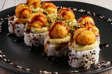 baked sushi rolls with cheese cap