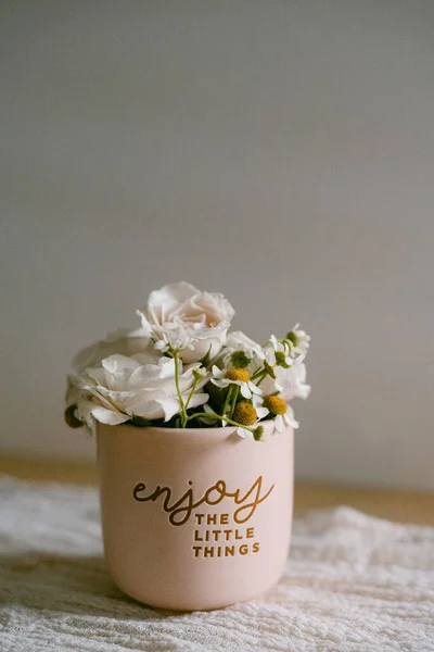 Mini flower vase with white roses