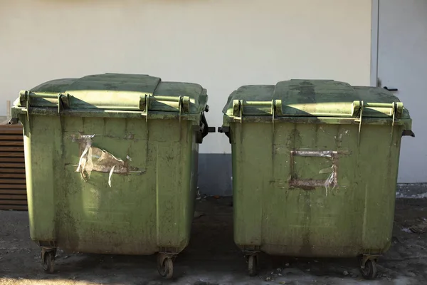Green garbage cans. Containers for waste on street.