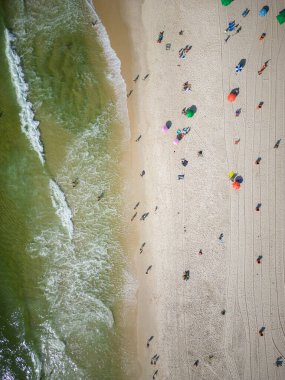 Beautiful top down view to Copacabana beach with water and beach umbrellas on the sand, Rio de Janeiro, Brazil