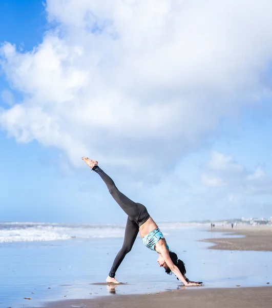 Woman Practicing Yoga Water Beach Doing Three Legged Downward Facing — Stok fotoğraf