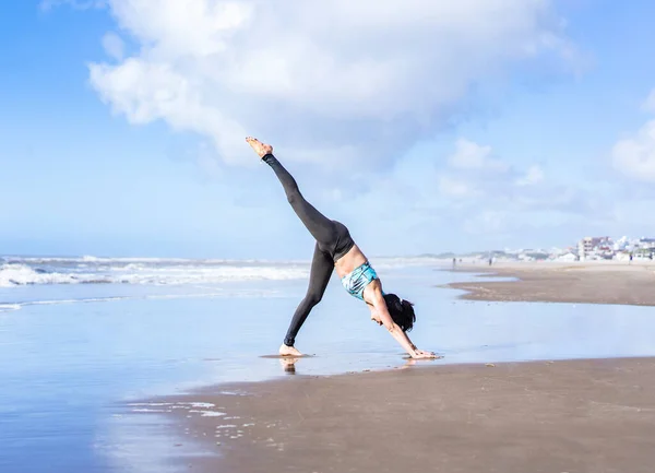 Woman Practicing Yoga Water Beach Doing Three Legged Downward Facing — 图库照片