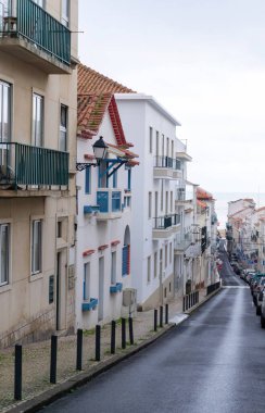 An empty old street leading to the ocean, in the historic center of the Portuguese city of Nazare
