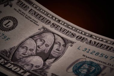 Dollar bill with multiple likenesses of George Washington