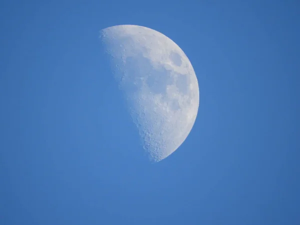 High zoom shot of the Moon on a blue sky