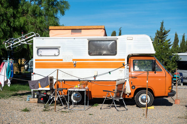 Old VW Motorhome camping on a sunny day in autumn 2022.