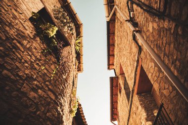 Facade of some beautiful mountain houses made with stone