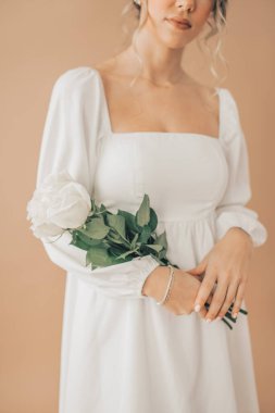 Close Up of Woman Elegantly Holding White Roses