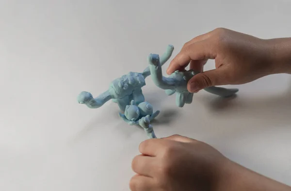 Child Playing Plasticine Dinosaur Figurines — Stock Photo, Image