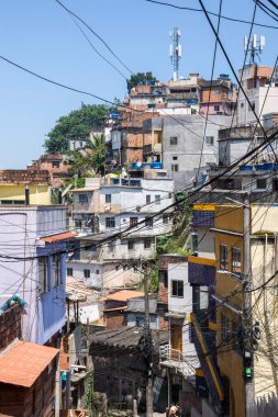 Beautiful view to poor favela houses on hill side and power lines, Rio de Janeiro, Brazil
